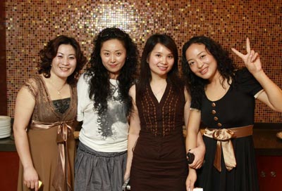 a group of Asian woman smiling